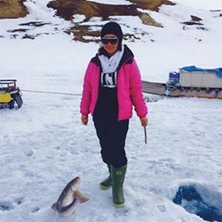 Rosalina Naqitarvik ice-fishing near Ikpiarjuk (Arctic Bay), NU.