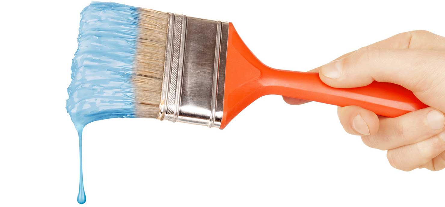 Red handled paint brush dripping blue paint