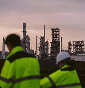 /-/media/images/news/2026/5/industrial-workers-with-refinery-in-background-listing.ashx?h=300&w=290&hash=04E58DD878E2F6783AFC141BD12D9B47