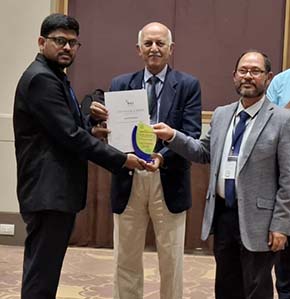 Akuleti Saikumar, Seligman travel bursary award winner being presented at conference